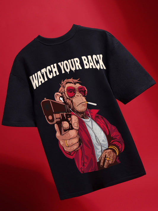 Black t-shirt with a graphic of a monkey holding a gun and 'Watch Your Back' text on a red background