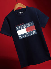 A navy blue cotton T-shirt with the text 'TUADDA KUTTA TOMMY' printed on the front.