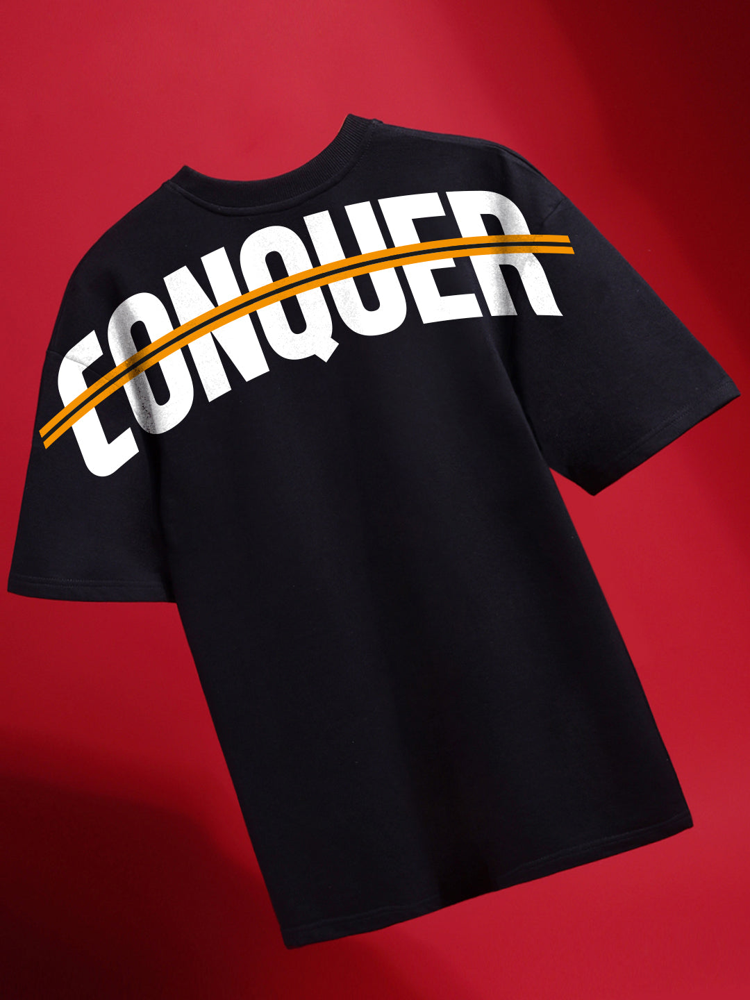 Black t-shirt with 'CONQUER' text on a red background