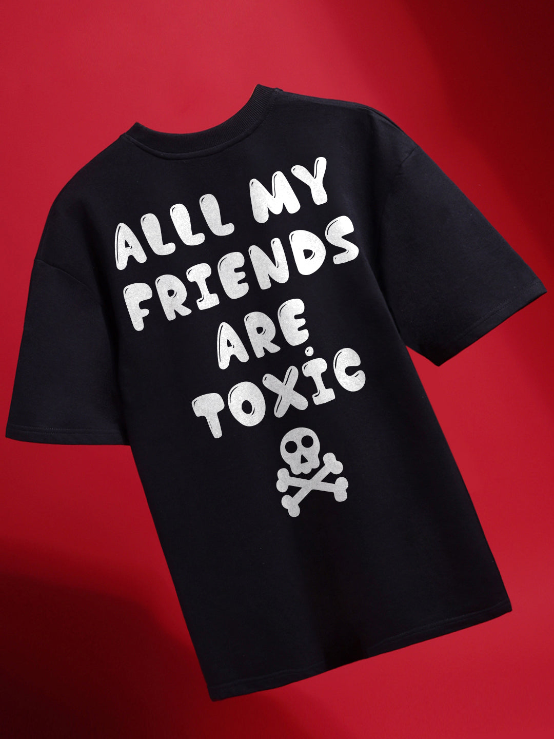 A black crew neck t-shirt with the text 'ALL MY FRIENDS ARE TOXIC' printed on the front, accompanied by a graphic of a skull and crossbones.