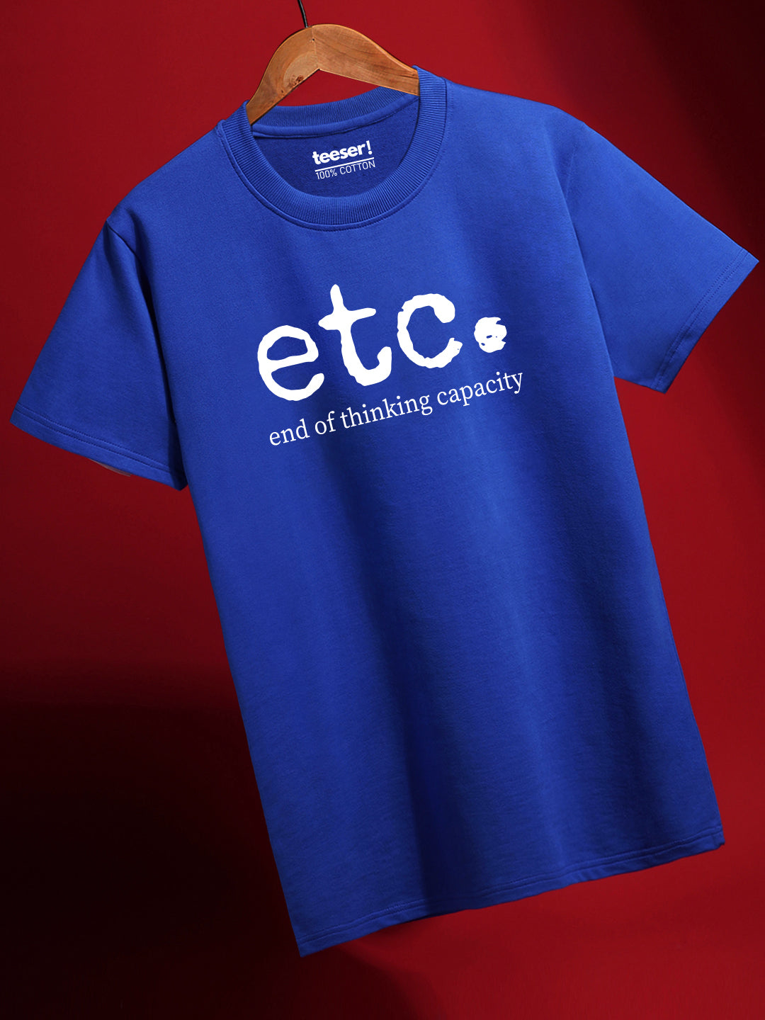Blue t-shirt with 'etc. end of thinking capacity' text on a red background